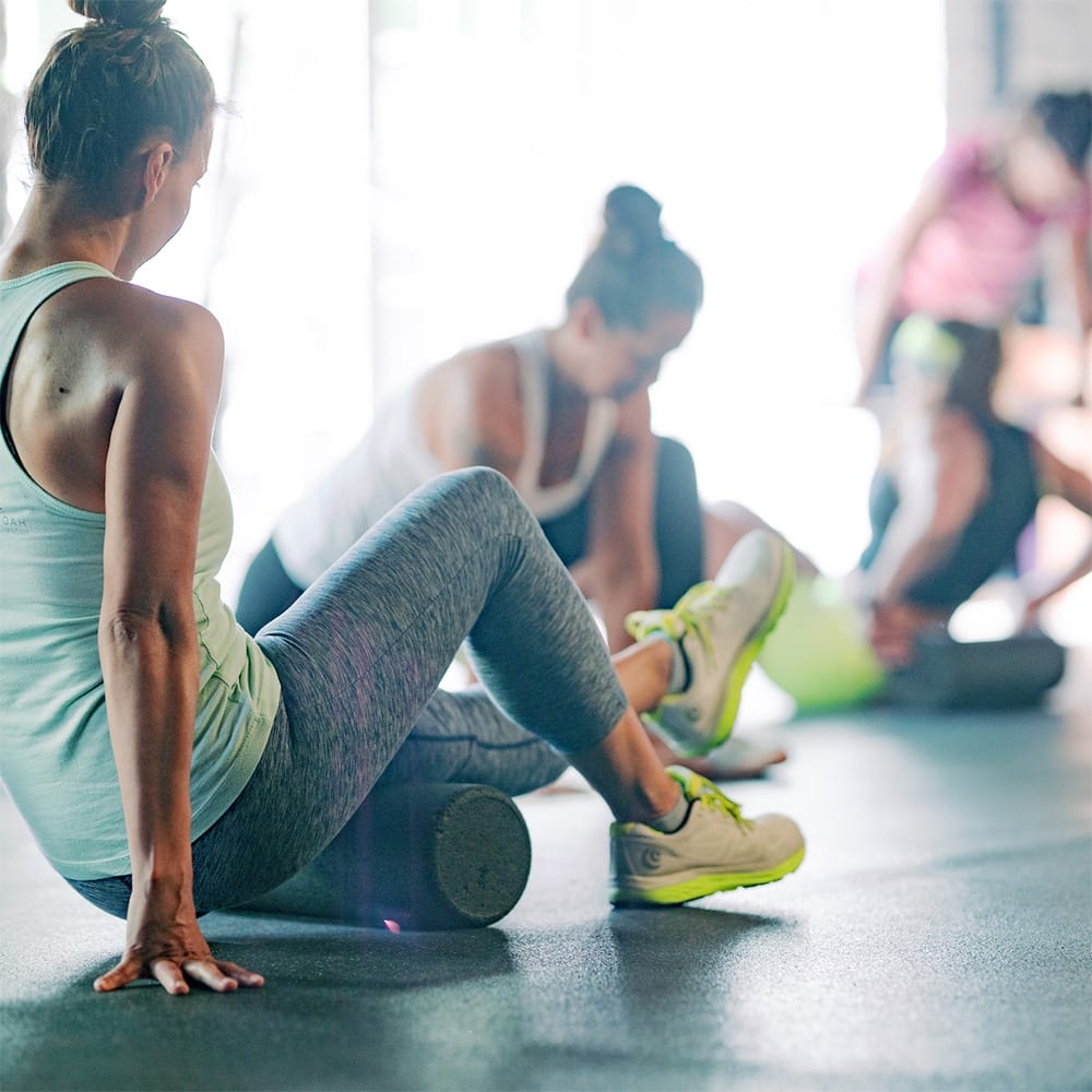 women exercising at their group training class